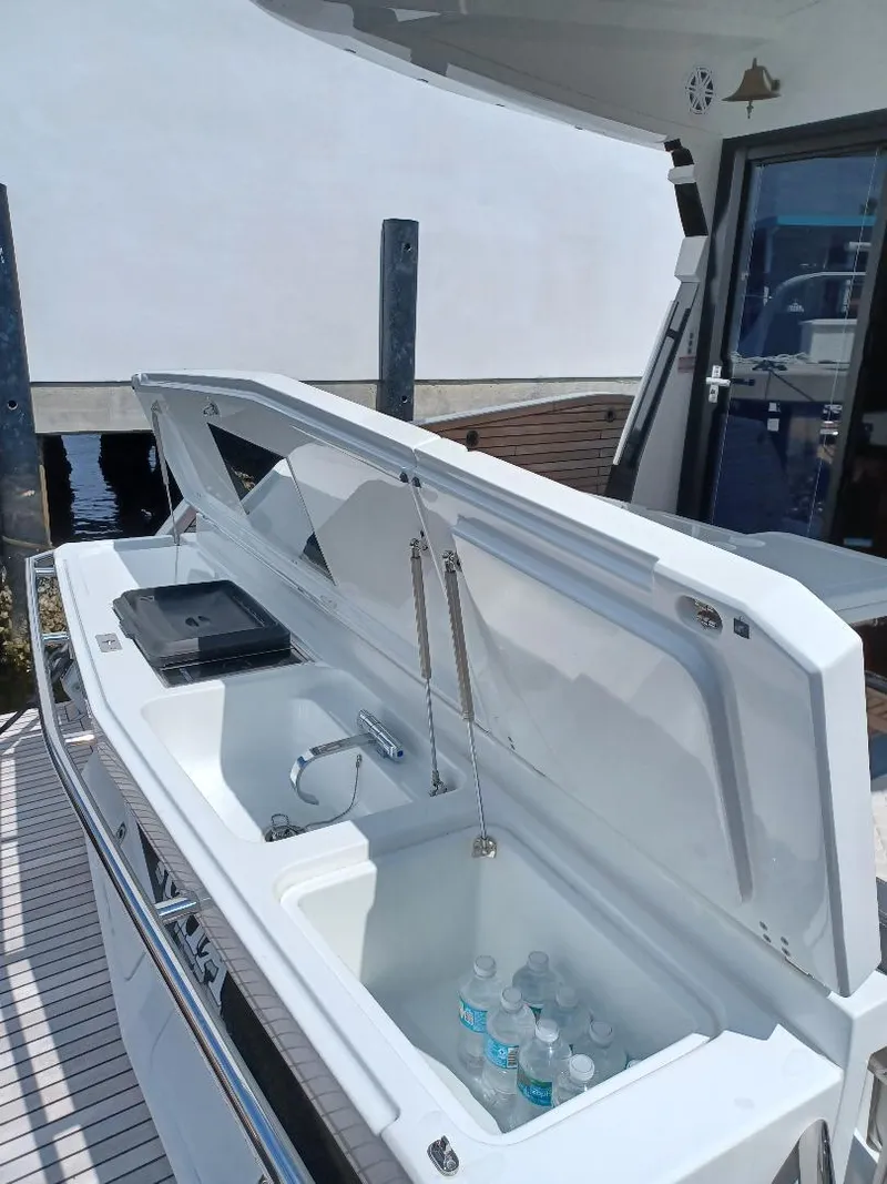 Slide: The Image of 2022 Galeon 410 HTC yacht with open deck storage and refreshments. - 8