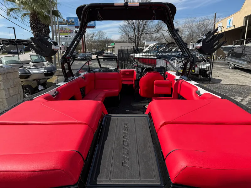 Slide: The Image of 2025 Moomba Tykon boat with vibrant red seating and sleek design. - 20