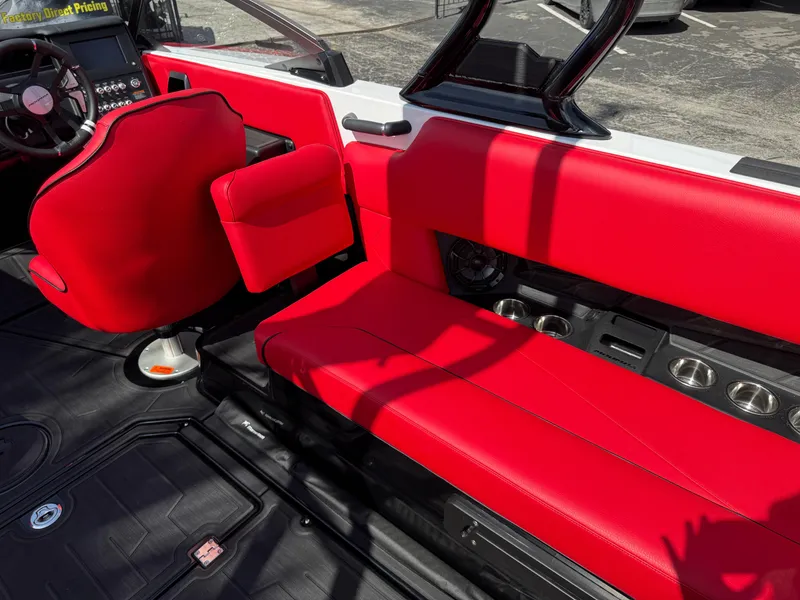 Slide: The Image of 2025 Moomba Tykon interior with vibrant red seating and modern dashboard design. - 41