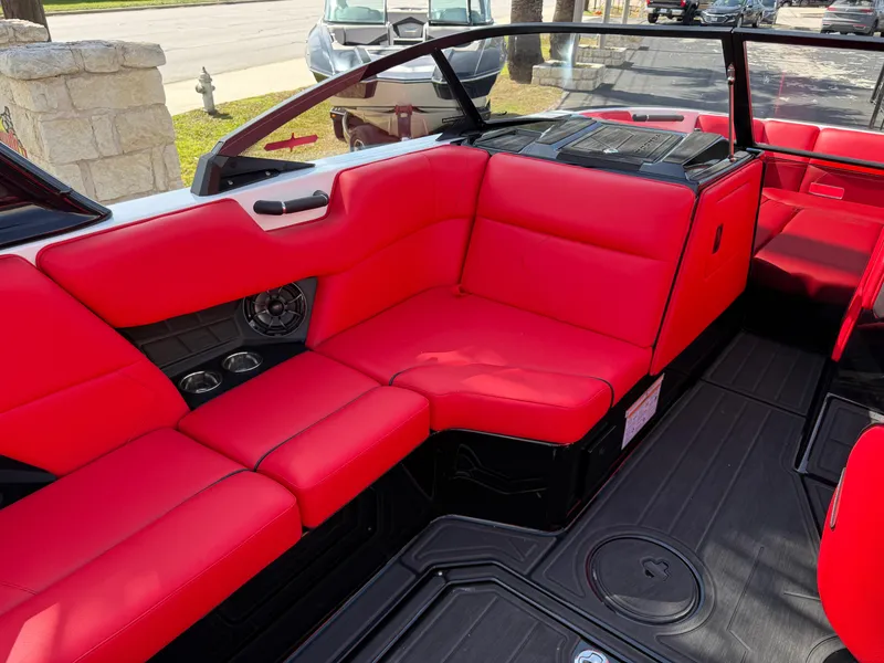 Slide: The Image of 2025 Moomba Tykon boat interior with vibrant red seating and sleek design. - 45