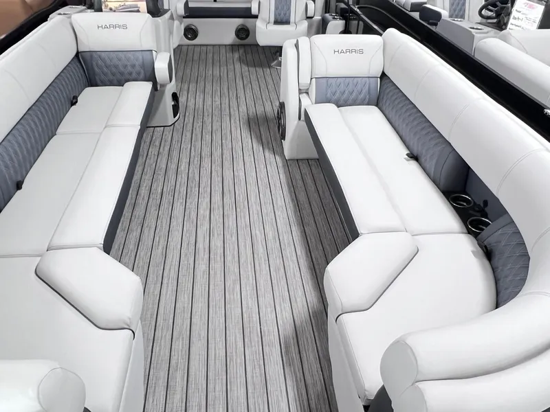 Slide: The Image of 2024 Harris Sunliner 250 boat interior with luxurious seating and sleek design. - 18