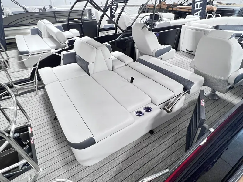 Slide: The Image of 2024 Harris Sunliner 250 boat interior with luxurious seating and modern design. - 21