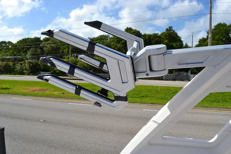 Slide: The Image of Chaparral 23 Surf 2021 wakeboard rack against a clear sky background. - 28