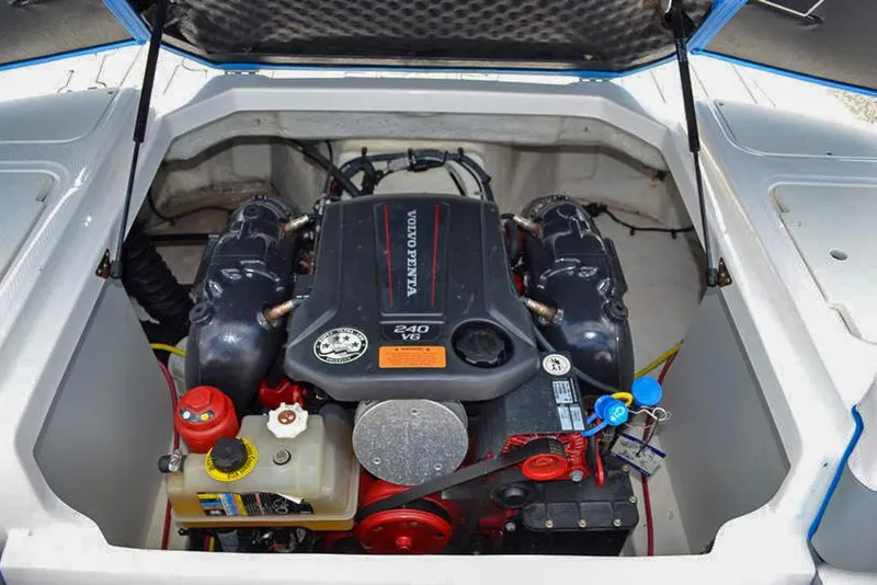 Slide: The Image of 2021 Chaparral 23 Surf boat engine compartment with Volvo Penta V6 240 engine. - 33