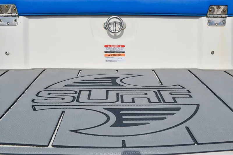 Slide: The Image of 2021 Chaparral 23 Surf boat deck with logo and warning labels. - 34