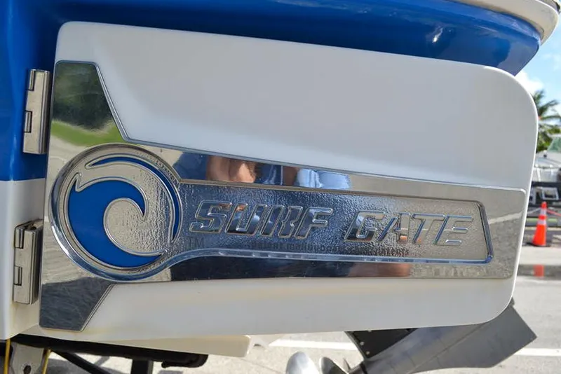 Slide: The Image of 2021 Chaparral 23 Surf boat with Surf Gate feature, close-up view. - 6