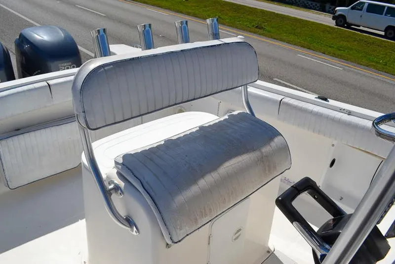 Slide: The Image of 2006 Clearwater 2500 WI CC boat with cushioned seating and steering console. - 10