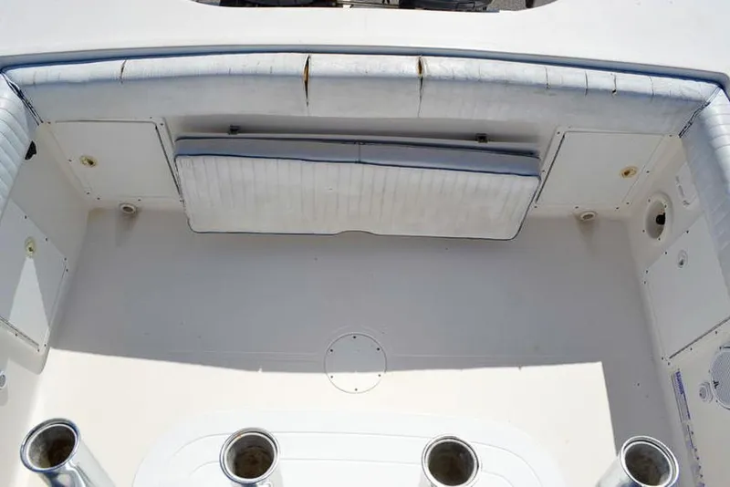 Slide: The Image of 2006 Clearwater 2500 WI CC boat interior with seating and rod holders. - 11