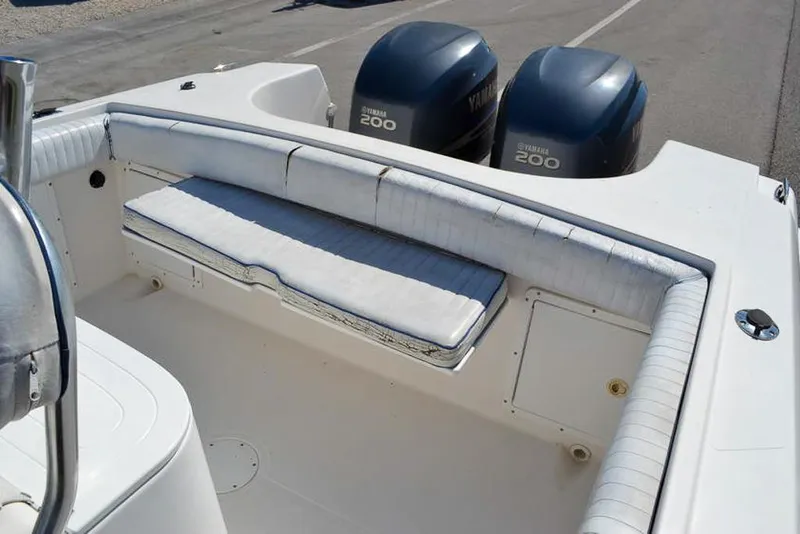 Slide: The Image of 2006 Clearwater 2500 WI CC boat with dual Yamaha 200 engines, featuring cushioned seating. - 13