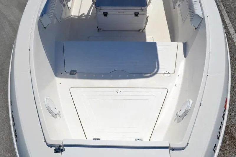 Slide: The Image of 2006 Clearwater 2500 WI CC boat interior, featuring spacious seating and storage areas. - 17