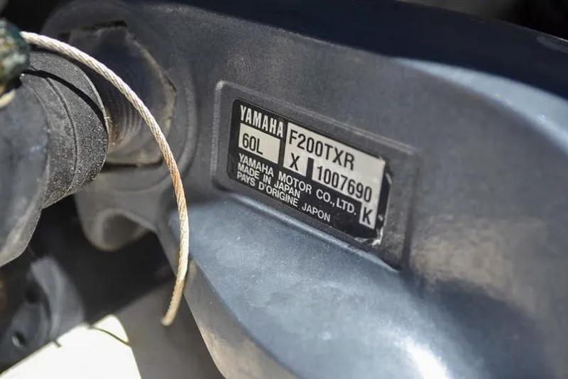 Slide: The Image of Close-up of Yamaha F200TXR engine label on 2006 Clearwater 2500 WI CC boat. - 23