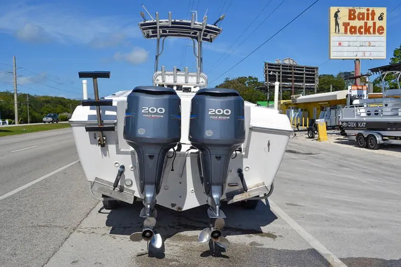 Slide: The Image of 2006 Clearwater 2500 WI CC boat with twin 200 HP engines near bait and tackle shop. - 4