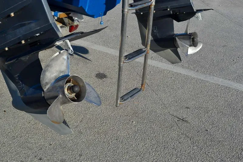 Slide: The Image of Dual propellers and ladder of a 2011 Glacier Bay 2740 Dual Console boat. - 10