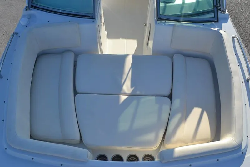 Slide: The Image of 2011 Glacier Bay 2740 Dual Console boat interior with cushioned seating. - 23