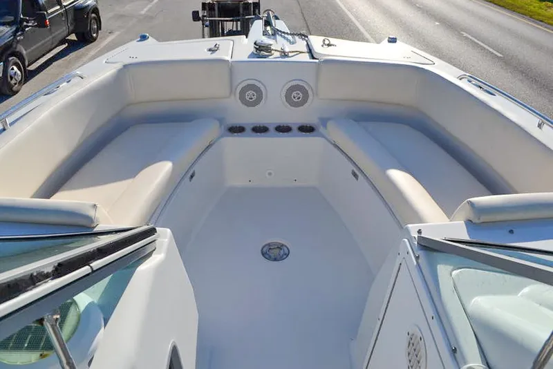 Slide: The Image of 2011 Glacier Bay 2740 Dual Console boat interior with seating and speakers. - 26