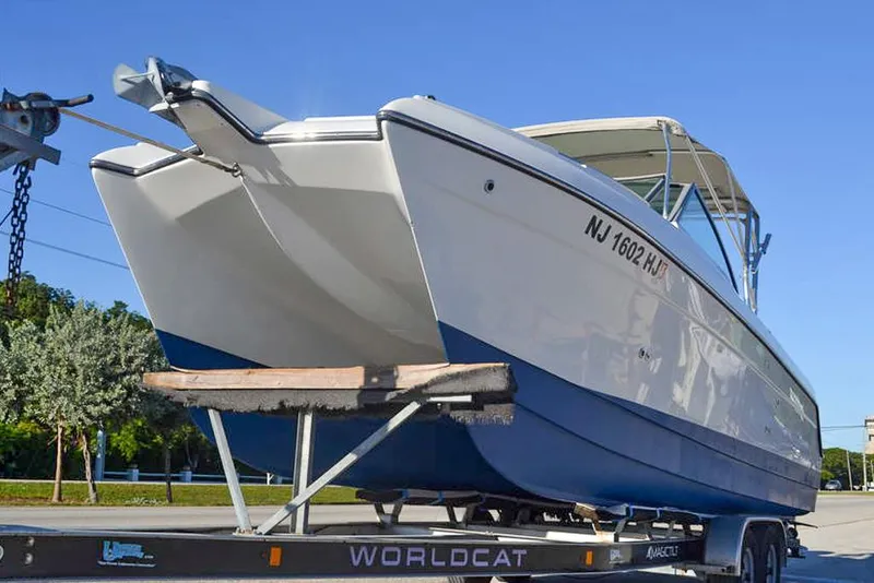 Slide: The Image of 2011 Glacier Bay 2740 Dual Console boat on trailer, side view. - 4