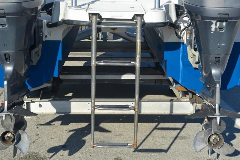 Slide: The Image of Rear view of 2011 Glacier Bay 2740 Dual Console boat with dual outboard motors. - 6