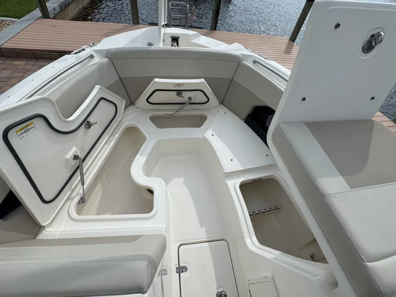 Slide: The Image of 2021 Boston Whaler 240 Vantage boat interior with open storage compartments. - 24