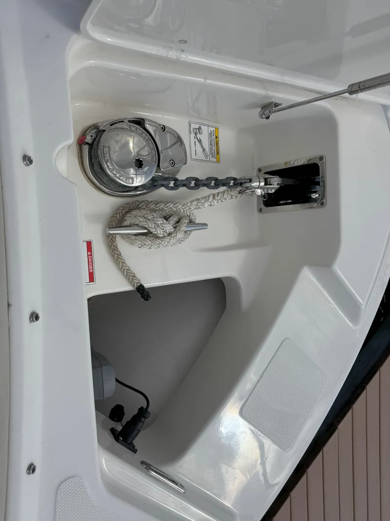 Slide: The Image of Anchor compartment of 2021 Boston Whaler 240 Vantage with rope and chain. - 28