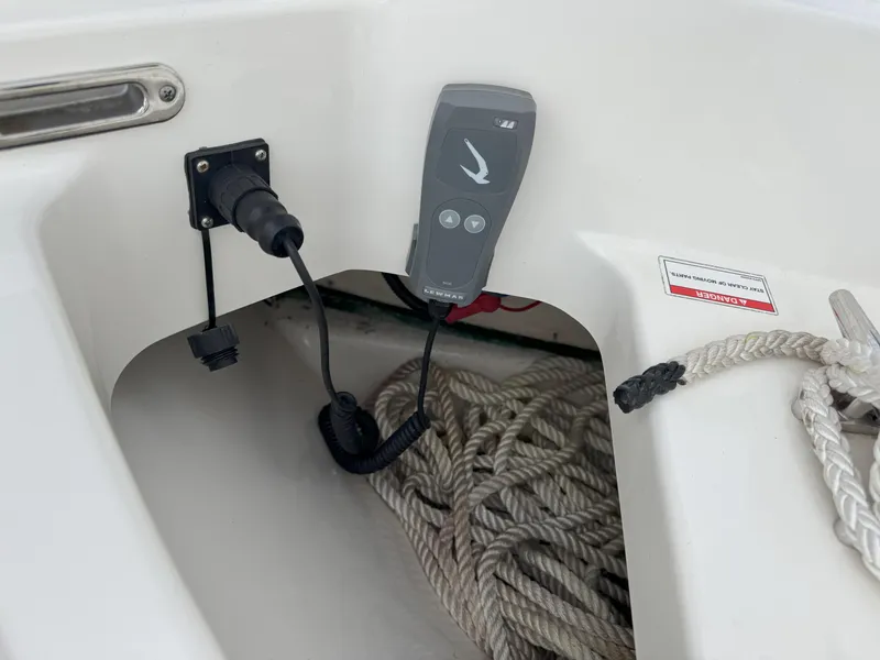 Slide: The Image of Boston Whaler 240 Vantage 2021 boat interior with ropes and control panel. - 30