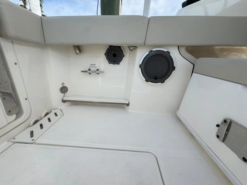 Slide: The Image of 2021 Boston Whaler 240 Vantage boat interior with speakers and seating. - 34