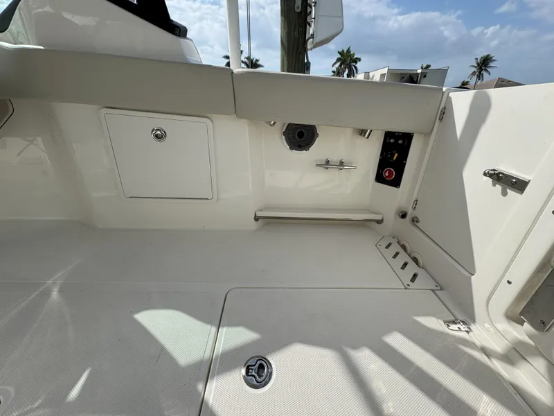 Slide: The Image of 2021 Boston Whaler 240 Vantage boat interior with seating and storage compartments. - 35