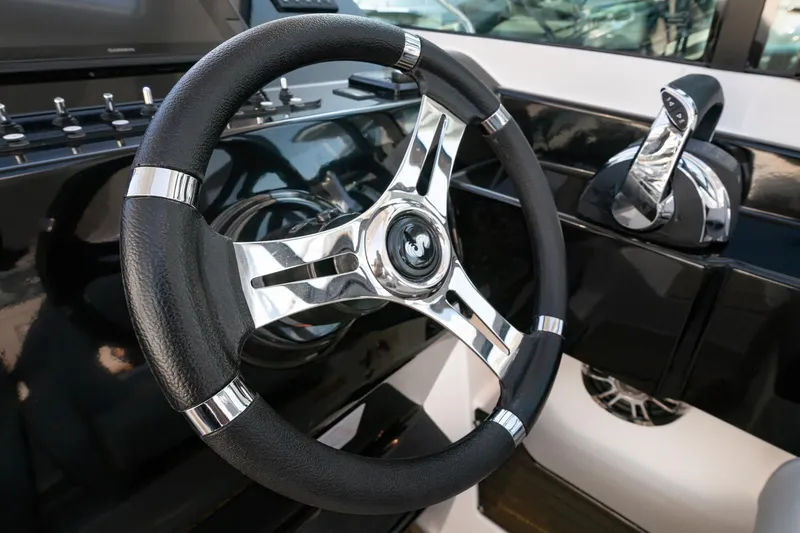 Slide: The Image of Steering wheel and controls of 2025 Beneteau 32 Gran Turismo yacht. - 14
