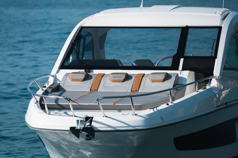Slide: The Image of 2025 Beneteau 32 Gran Turismo yacht on serene blue water. - 5