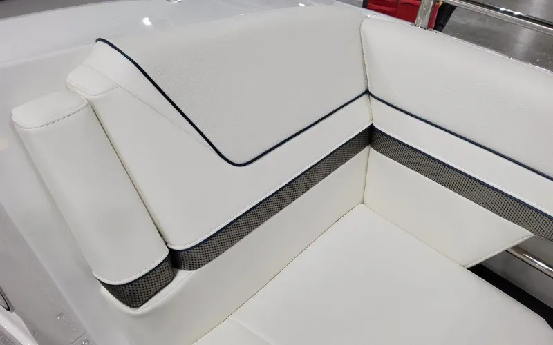 Slide: The Image of 2025 Formula 310 Bowrider I/O, white leather seating detail with black trim. - 10