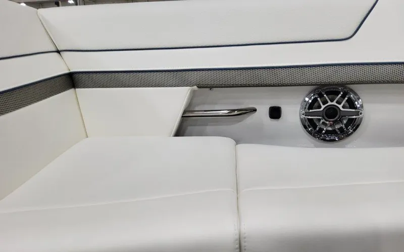 Slide: The Image of 2025 Formula 310 Bowrider I/O interior with white seating and speaker detail. - 11