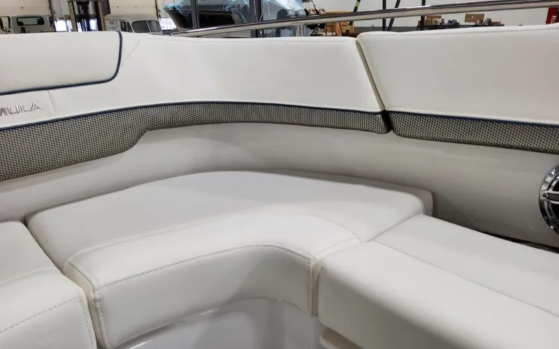 Slide: The Image of 2025 Formula 310 Bowrider I/O interior with white cushioned seating and sleek design. - 14