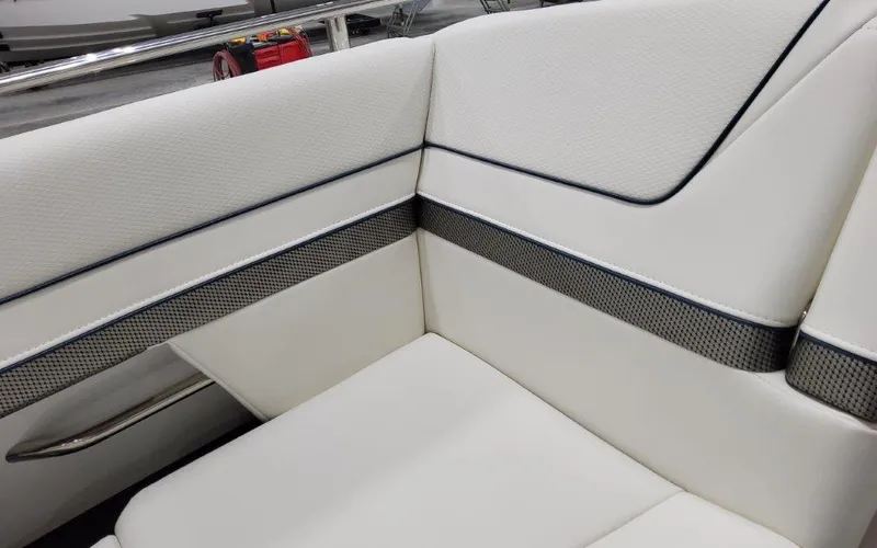 Slide: The Image of 2025 Formula 310 Bowrider I/O interior seating with white upholstery and sleek design. - 16
