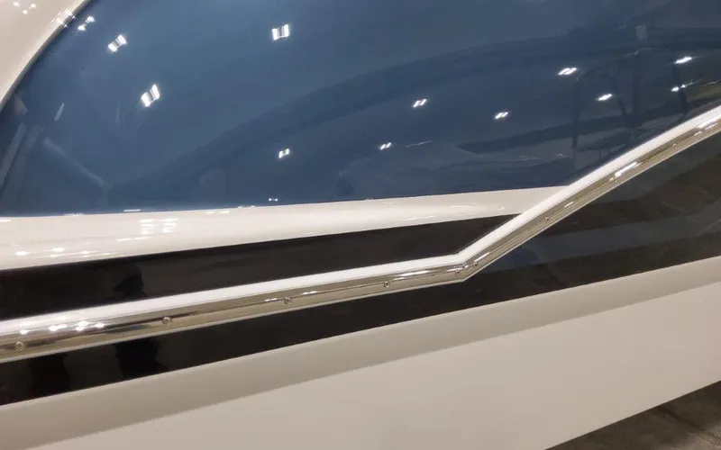 Slide: The Image of 2025 Formula 310 Bowrider I/O boat, sleek blue and white exterior design. - 2