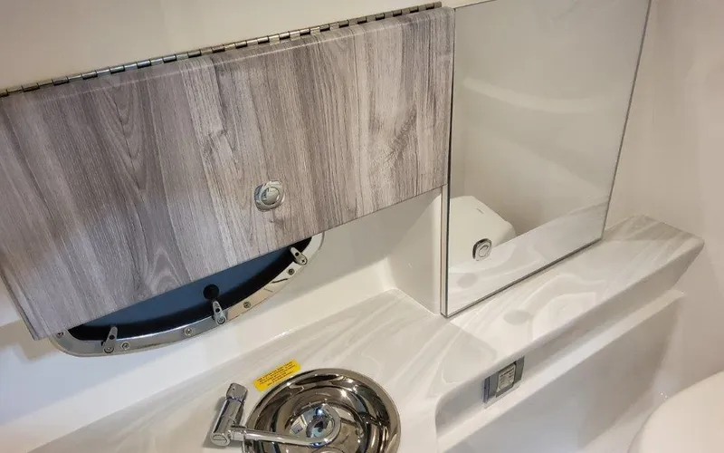 Slide: The Image of 2025 Formula 310 Bowrider I/O interior with sleek cabinetry and modern fixtures. - 24