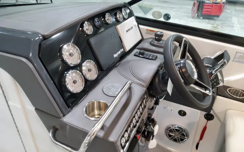 Slide: The Image of 2025 Formula 310 Bowrider I/O dashboard with modern controls and steering wheel. - 28