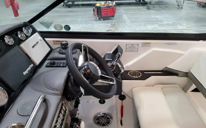 Slide: The Image of Interior of 2025 Formula 310 Bowrider I/O boat with steering wheel and controls. - 29