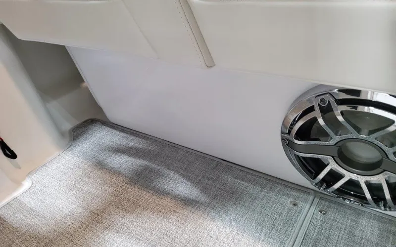 Slide: The Image of 2025 Formula 310 Bowrider I/O interior with speaker and carpeted flooring. - 30