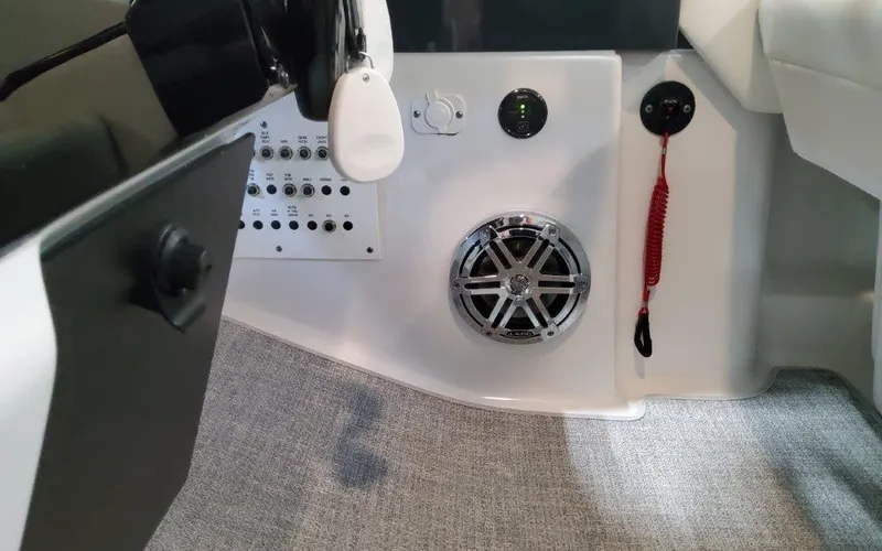Slide: The Image of Interior of 2025 Formula 310 Bowrider I/O, featuring control panel and speaker system. - 31