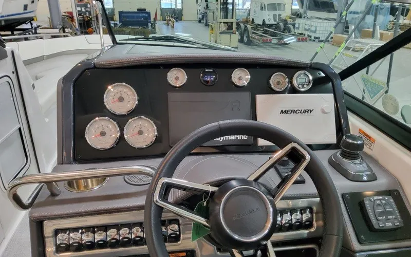 Slide: The Image of Dashboard of 2025 Formula 310 Bowrider I/O boat with steering wheel and gauges. - 32