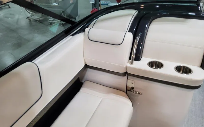 Slide: The Image of 2025 Formula 310 Bowrider I/O interior with white seating and cup holders. - 36