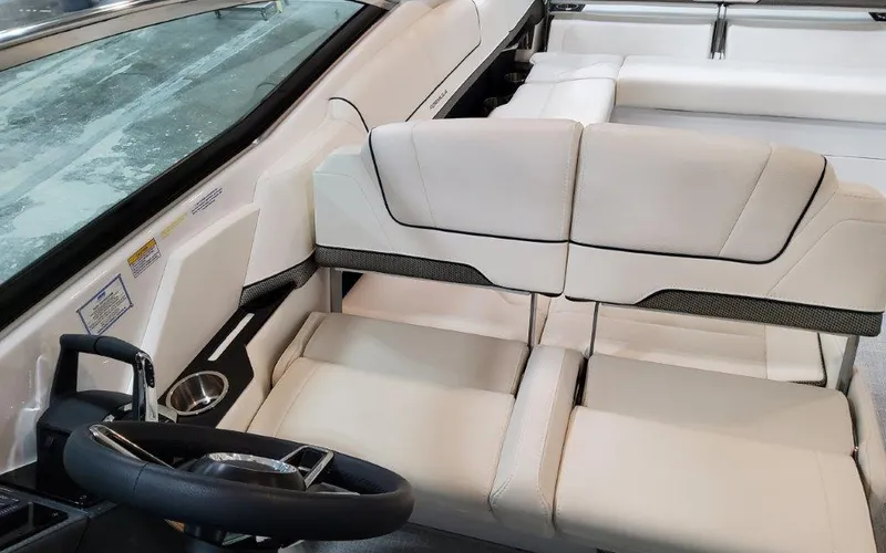 Slide: The Image of 2025 Formula 310 Bowrider I/O interior with sleek white seating and modern steering wheel. - 45