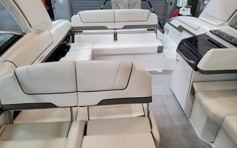 Slide: The Image of 2025 Formula 310 Bowrider I/O interior with luxurious white seating and modern design. - 46