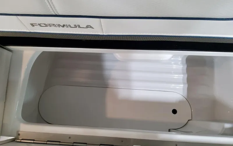 Slide: The Image of 2025 Formula 310 Bowrider I/O storage compartment, sleek design, white interior. - 47