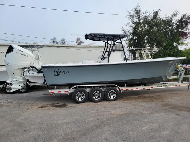 Slide: The Image of 2024 C-Hawk 29 Center Console boat on trailer, side view. - 7