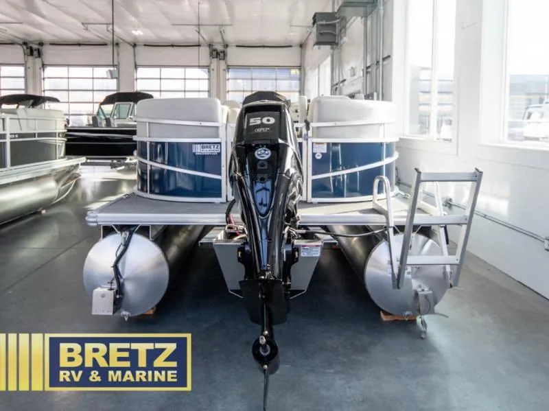 Slide: The Image of 2025 Vista Fish 18 pontoon boat with 50 HP engine at Bretz RV & Marine showroom. - 3