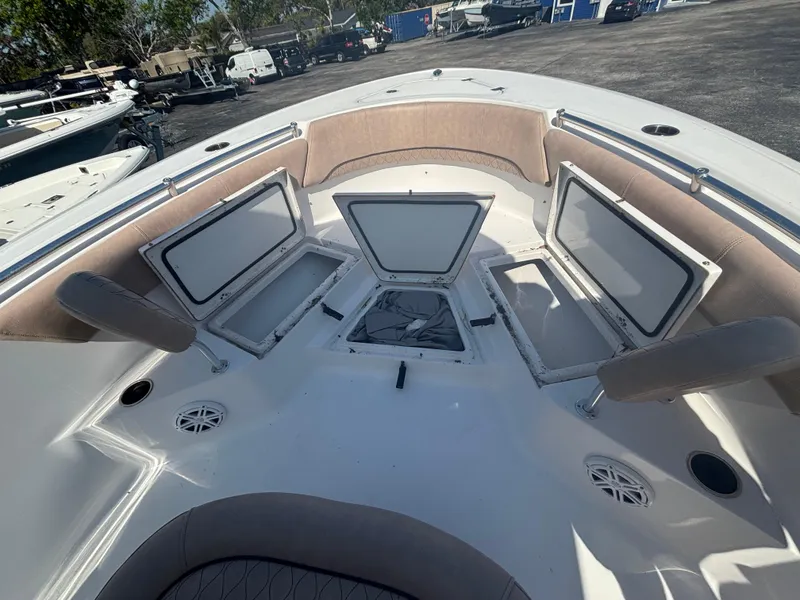 Slide: The Image of 2020 Sportsman Heritage 231 Center Console boat with open storage compartments. - 5