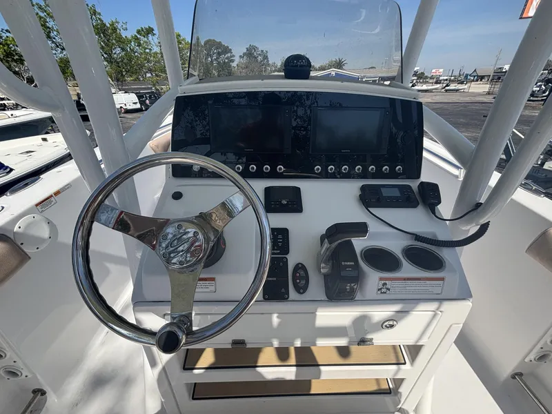 Slide: The Image of 2020 Sportsman Heritage 231 Center Console dashboard with steering wheel and navigation controls. - 6