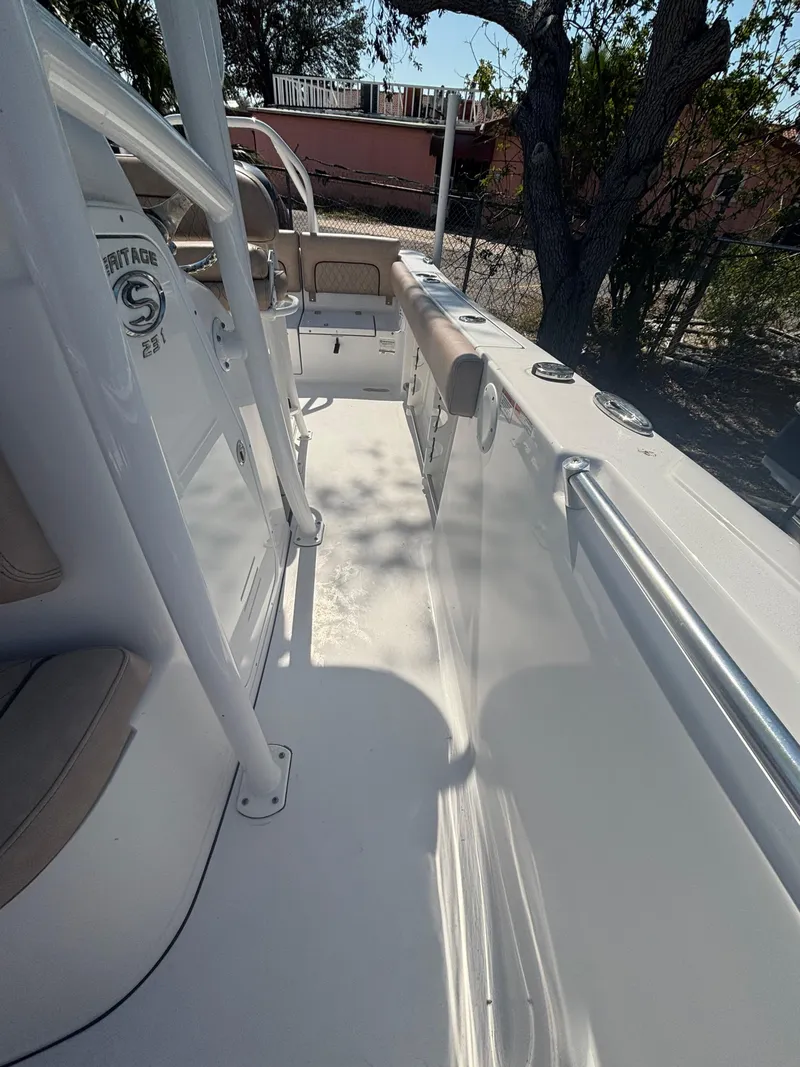 Slide: The Image of 2020 Sportsman Heritage 231 Center Console boat deck with seating and railing. - 7