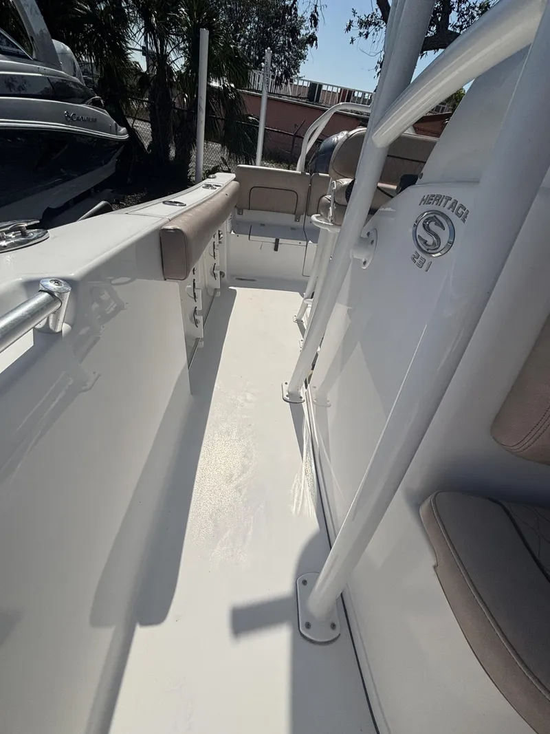 Slide: The Image of 2020 Sportsman Heritage 231 Center Console boat interior with seating and console view. - 8