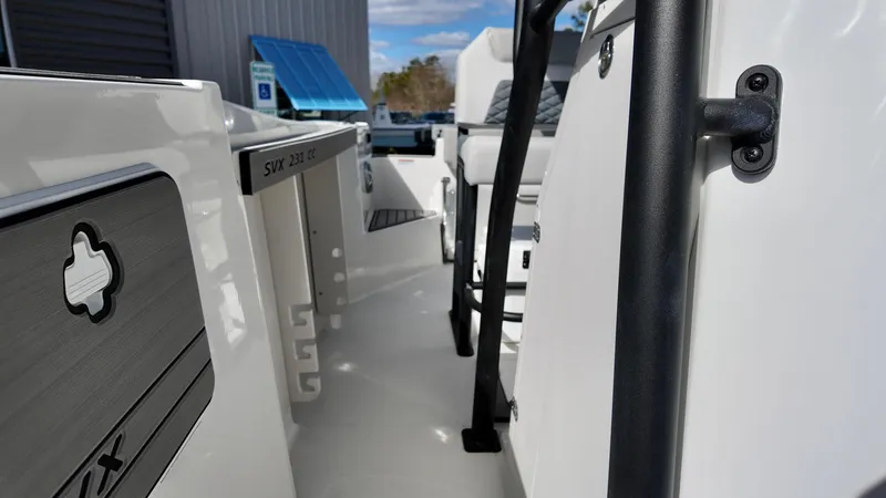 Slide: The Image of 2025 Starcraft SVX 231 OB boat interior, showcasing sleek design and modern features. - 11
